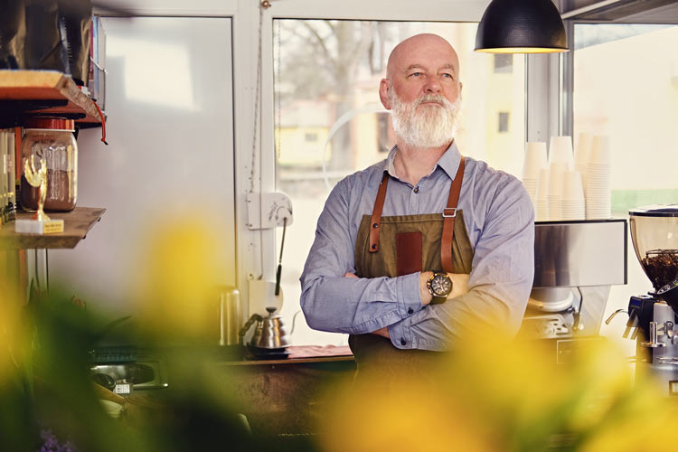 confident grandfather barista