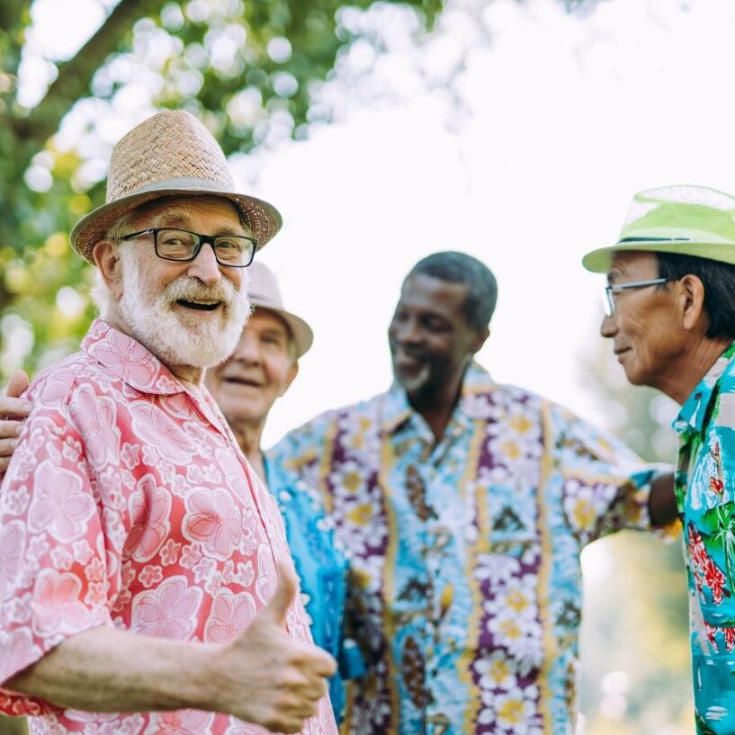 group of senior friends playing at the park